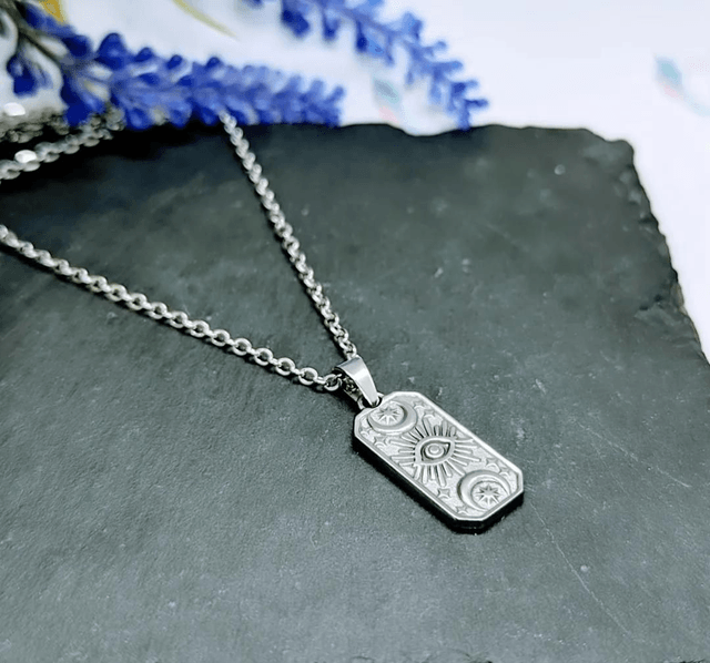 Stainless Steel Necklace with Sun, Moon & Star Pendant.